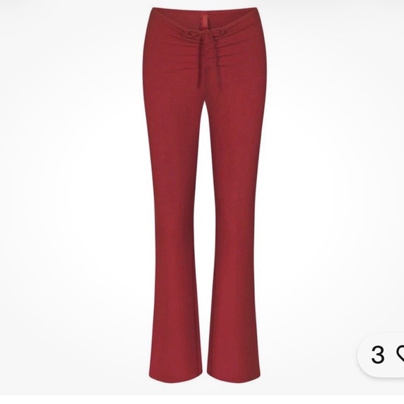 SKIMS Ribbed Drawstring Boot-Cut Pants in Deep Red - Picture 3 of 9